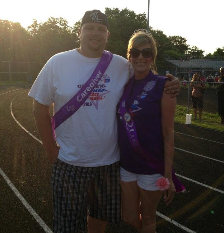 Diana Adams and her husband Douglas wearing purple Caregiver sashes