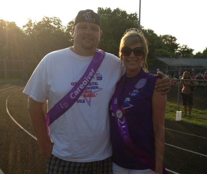 Diana Adams and her husband Douglas wearing purple Caregiver sashes