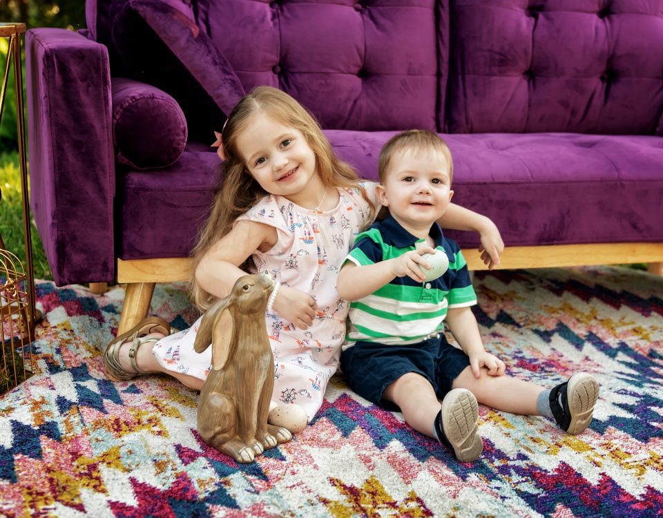 Kate Sherwin's kids (Lyla and Noah) on Easter in front of a purple couch