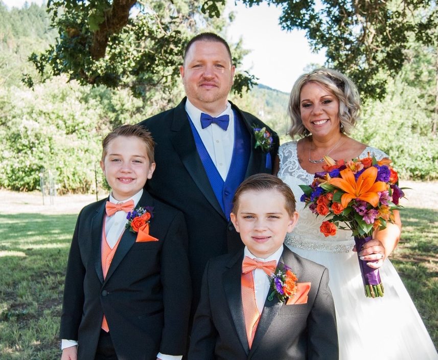 Amie and Keith Brewer celebrating their wedding with their boys