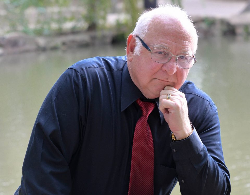 Ron Purpora posing in front of the river