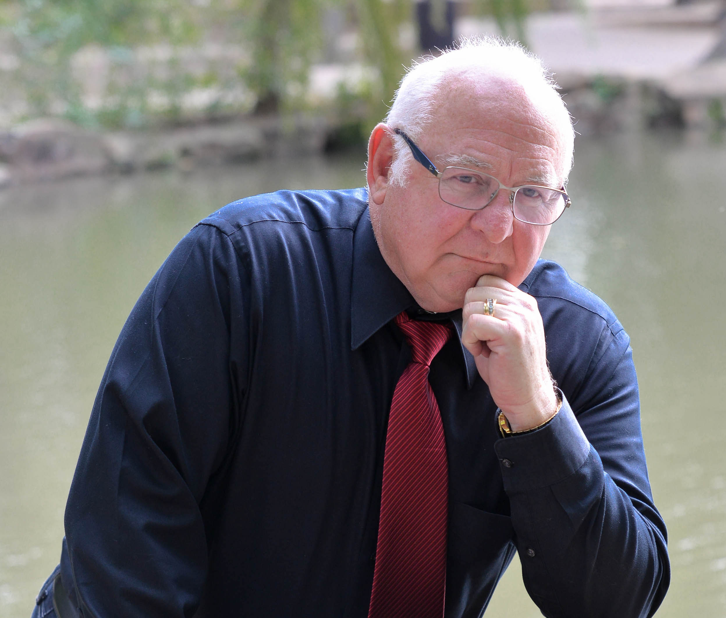 Ron Purpora posing in front of the river