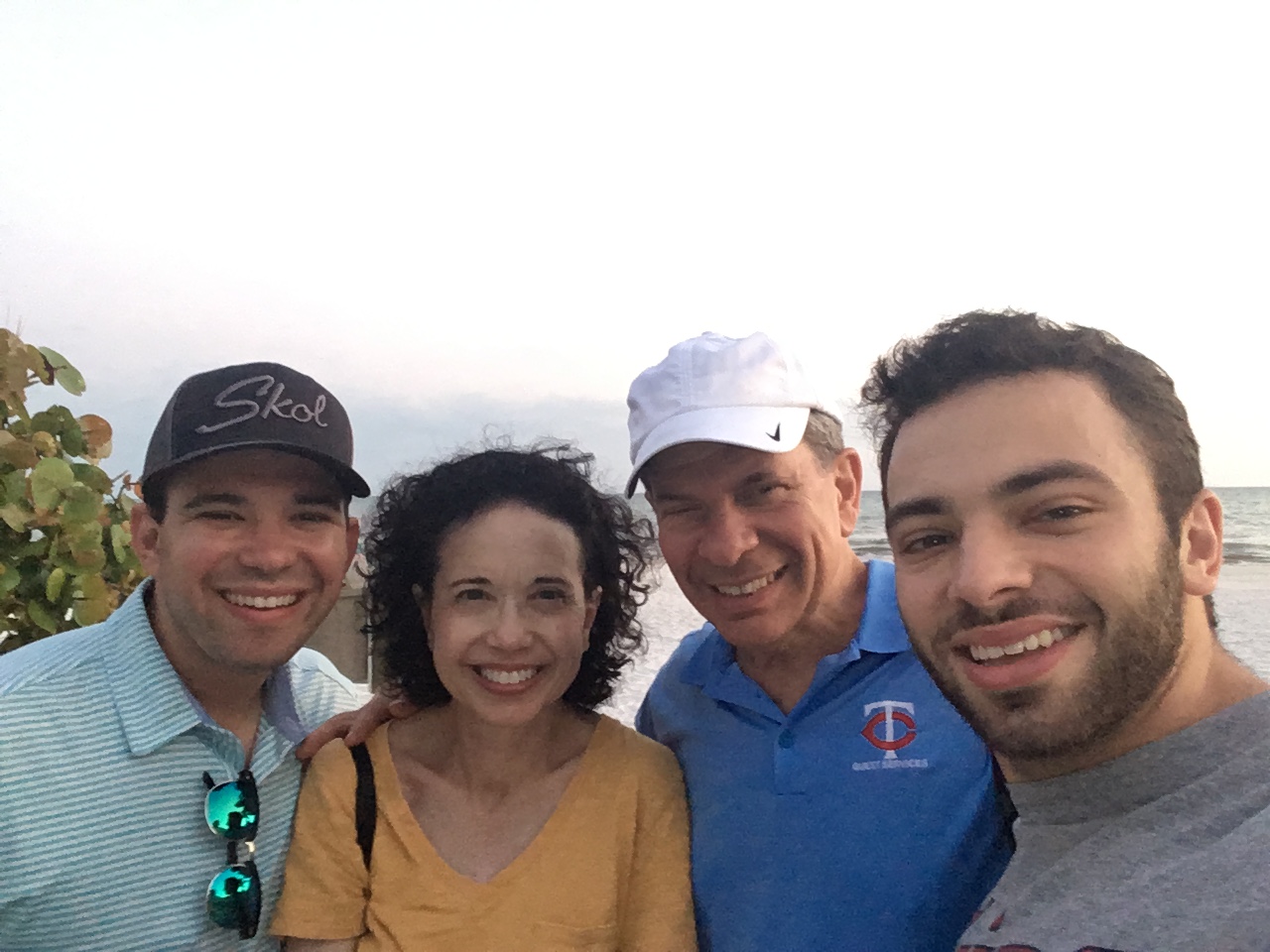 Barry Kelner with his wife and sons at the beach wearing Minnesota Twins guest services polo