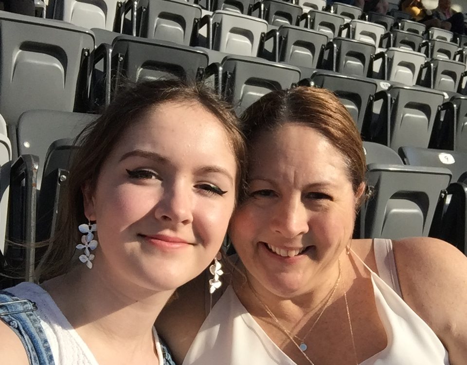 Kristin Wallace and daughter sitting in their seats waiting for the event to start