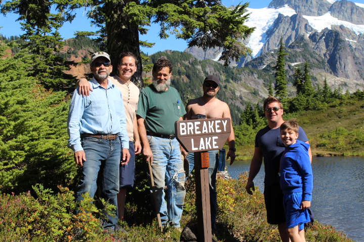 the breakey family at breakey lake behind the breakey lake sign