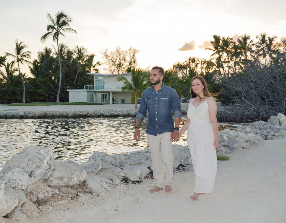 Adrian and Leslie enjoying a nice walk on the sand along the water and rocks