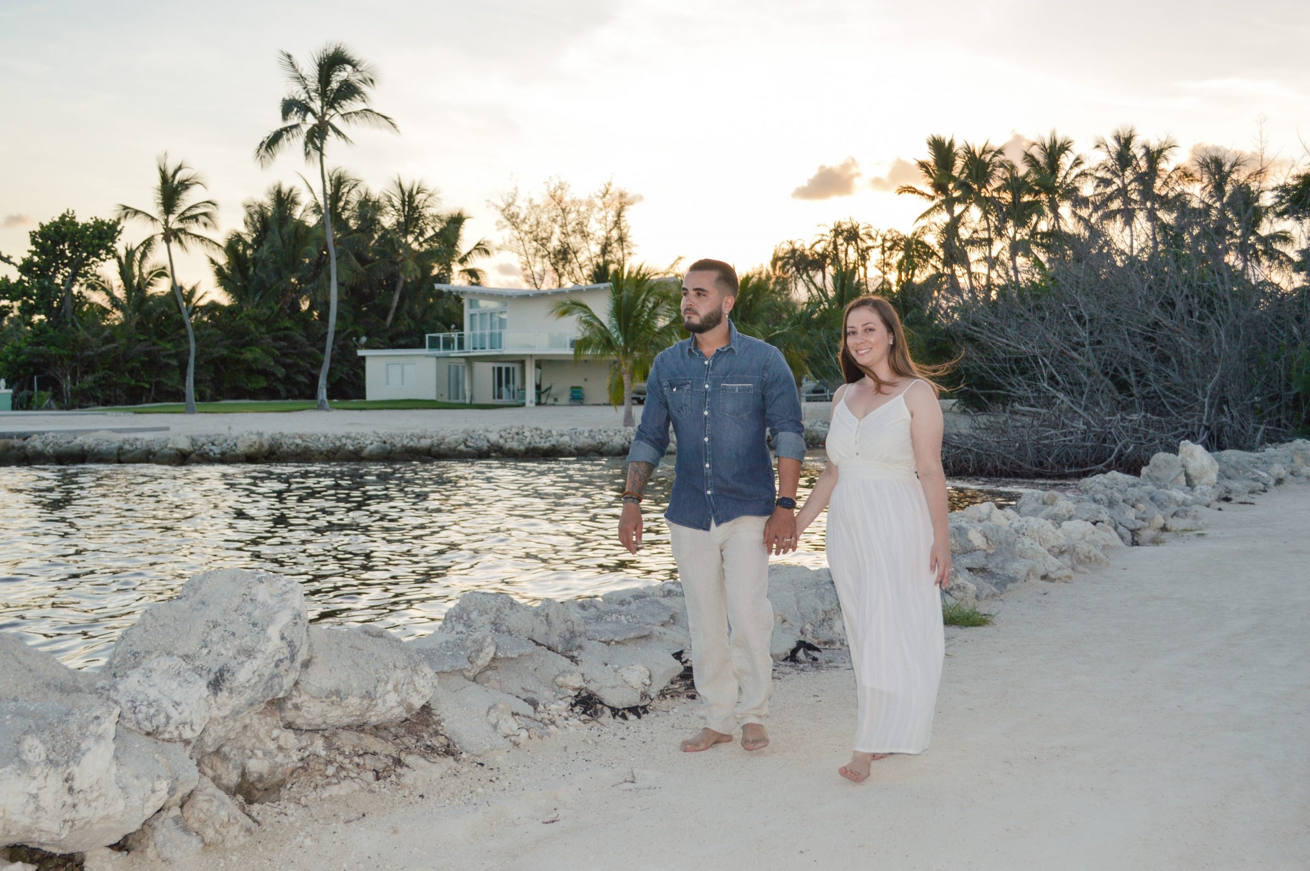 Adrian and Leslie enjoying a nice walk on the sand along the water and rocks