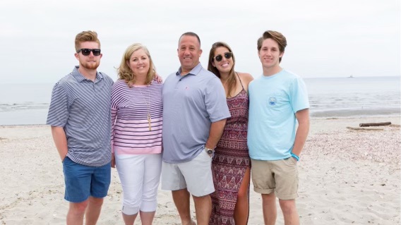 Suzanne Nicklaus and her family on the sand at the beach