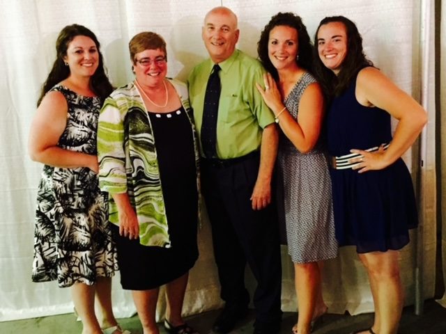 Bob and Jody Hamilton with their kids all dressed up