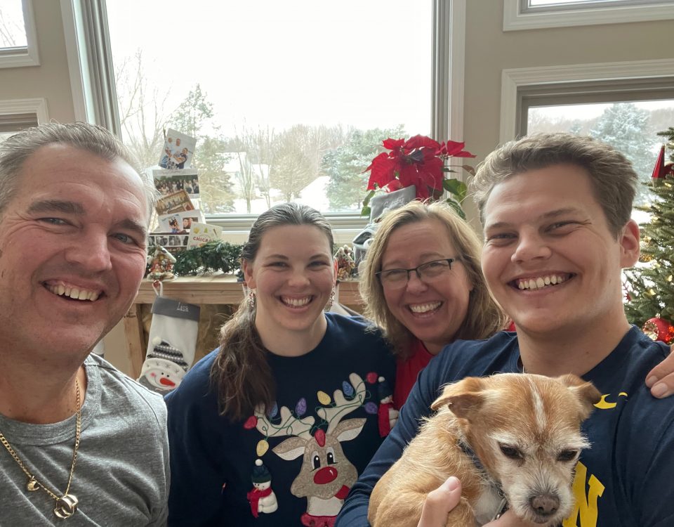 Lisa Petersmark with her family and their family dog at Christmas