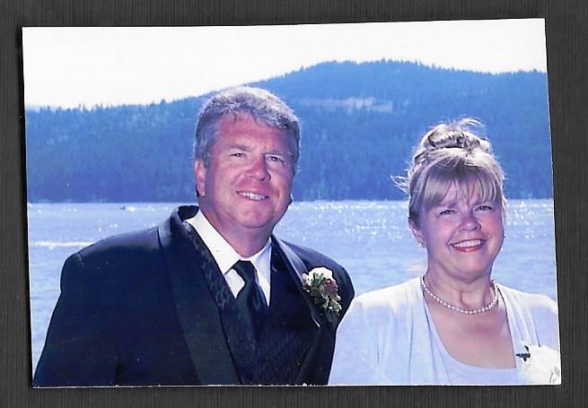 nick and nancy snider dressed fancy in front of the lake