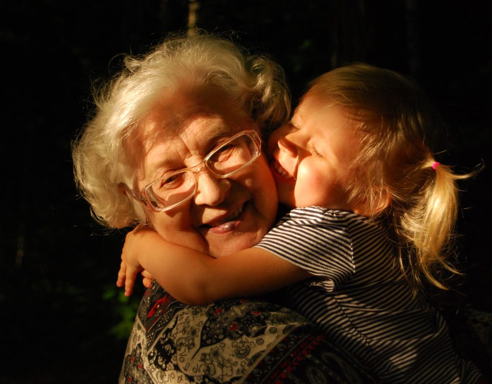 grandma and granddaughter hug