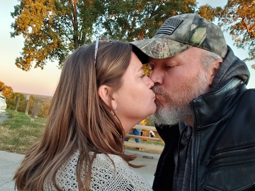 John and Sylvia Titus smooching during fall time