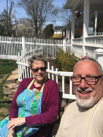 Ellen & Pat sitting in their front yard