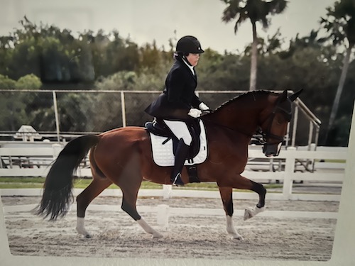 Kellie Kaspriske on horseback in a show competition with Zulu