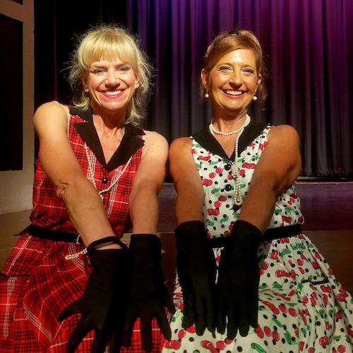 Amy Kotansky and her dancing friend Nancy in their dresses and black gloves