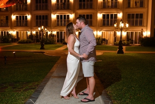 Krystin Johnson kissing her husband Derek in dressy clothes outside at night