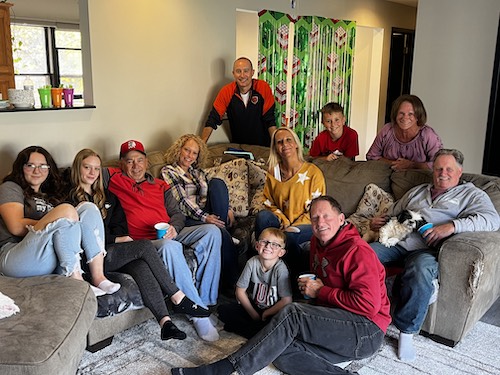 Neely Schaefer's and her family all hanging out on the sectional couch