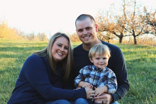 Aubrey Bush and her people in the green grass during the fall