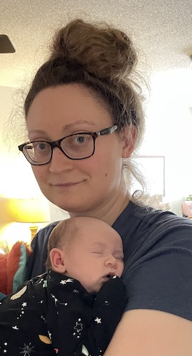 Sarah Dvorak holding her baby tight