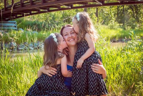 Rachel Newell and her girls hanging out in the flowers