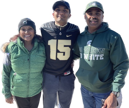 Anu Sreenivasan with her family wearing Purdue and Michigan State clashing gear