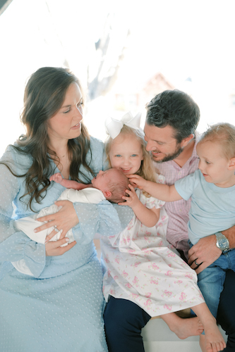 Meredith Pendleton and her family taking a family photo together