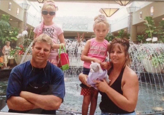 Marylou Ward with Frank and their daughters in front of a fountain