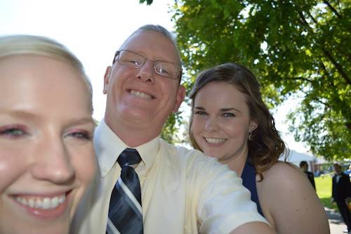 Pastor George Reynolds with his girls all dressed up