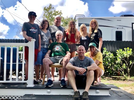 Carol Nobles' family photo taken on the porch with their RV in the background