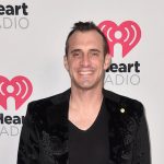 Doug Gottlieb in front of iHeart Radio backdrop