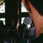 standing behind the mic while public speaking