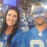 Kylie and River Boyd at a Lions game in throwback jerseys