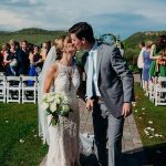 PJ and Macy kissing outside on their wedding day