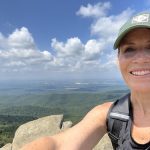 Erin Chubb on top of a mountain