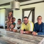 Jennifer Meyer behind the kitchen island with her family