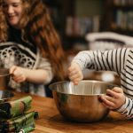 son cooking with Mom in the kitchen