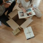 Parents packing their sentimental gifts for a child moving out